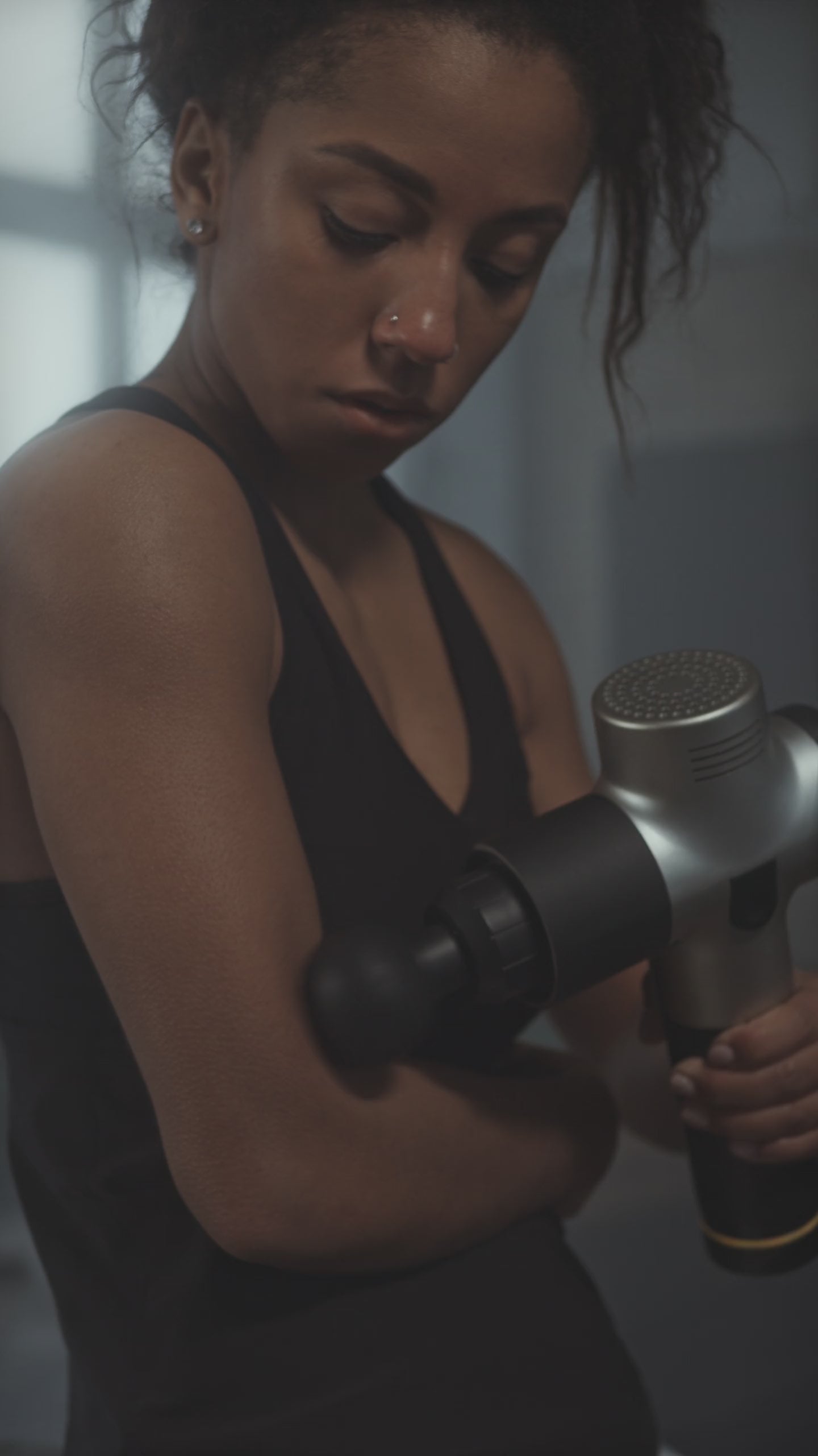 Percussion Massage Gun — in use